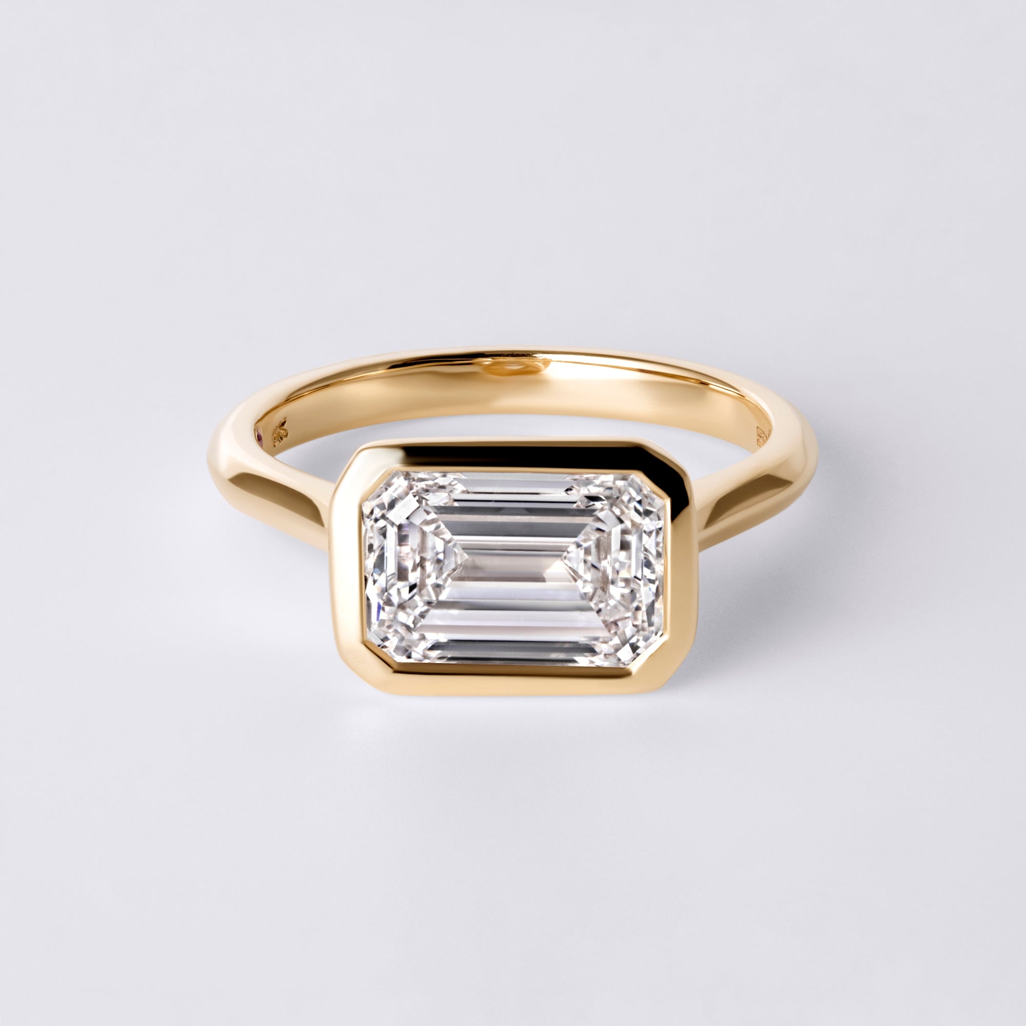 Lori 3.07CT Emerald East/West Bezel Set Engagement Ring, Yellow Gold