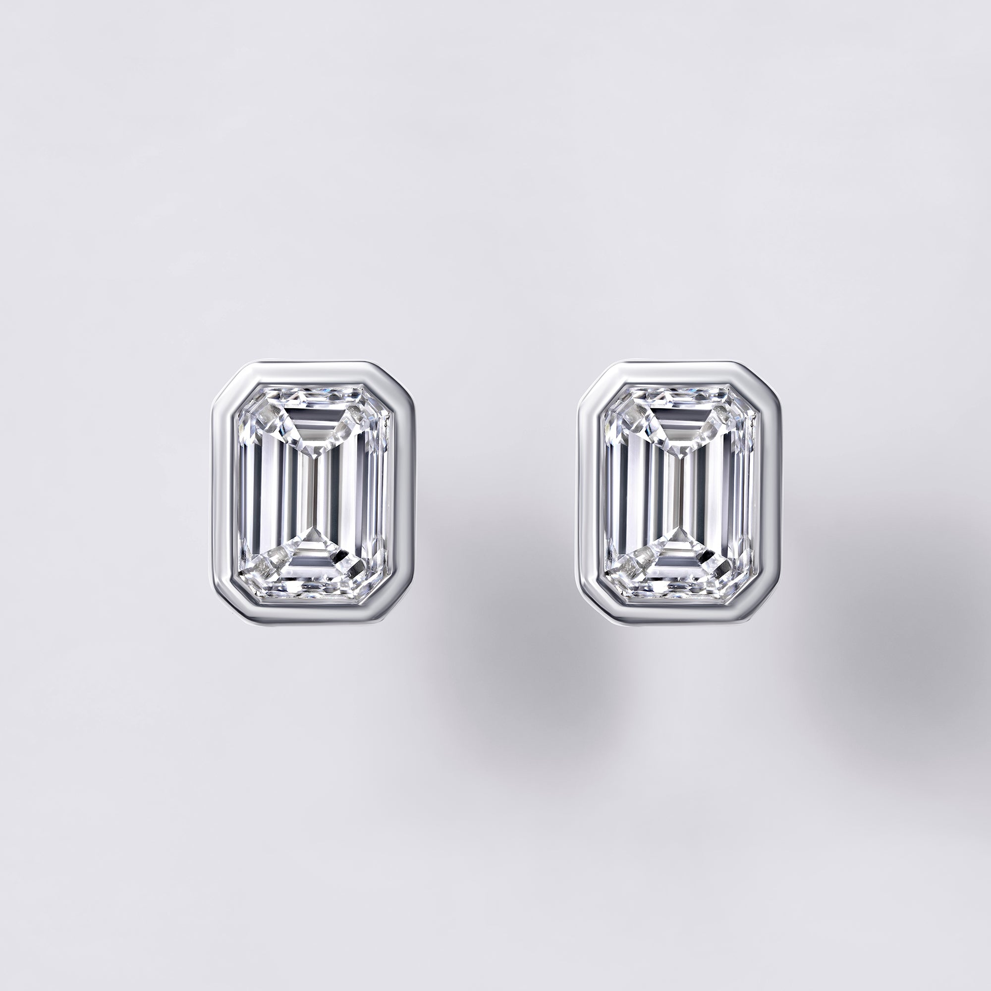 Bezel Set Emerald Cut Diamond Stud Earrings