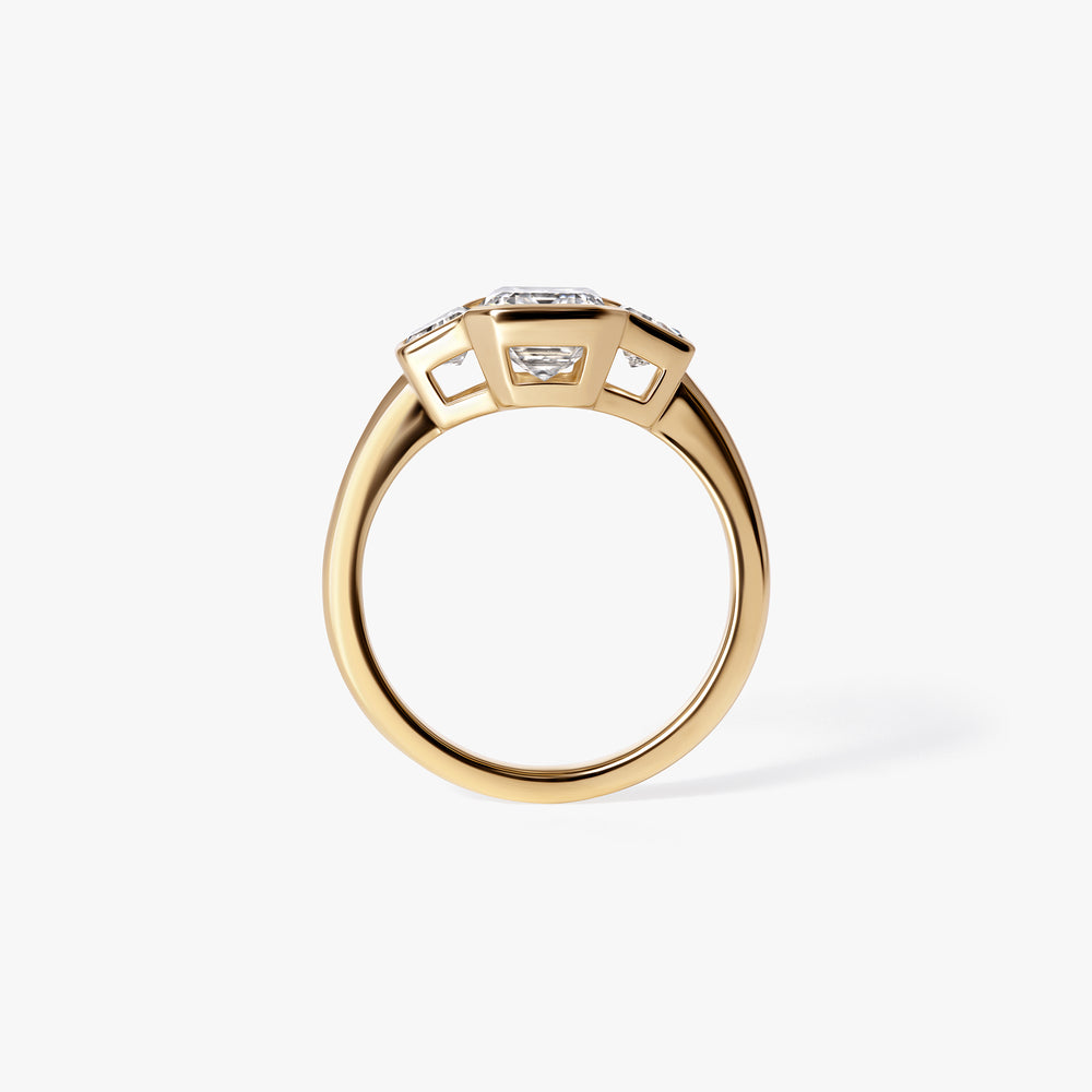 2.07CT Emerald and Trapezoid Bezel Three Stone Engagement Ring