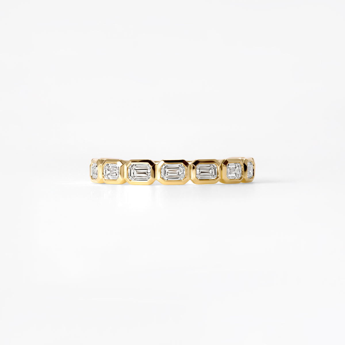 Emerald Cut Diamond East West Bezel Set Three Quarter Eternity Band