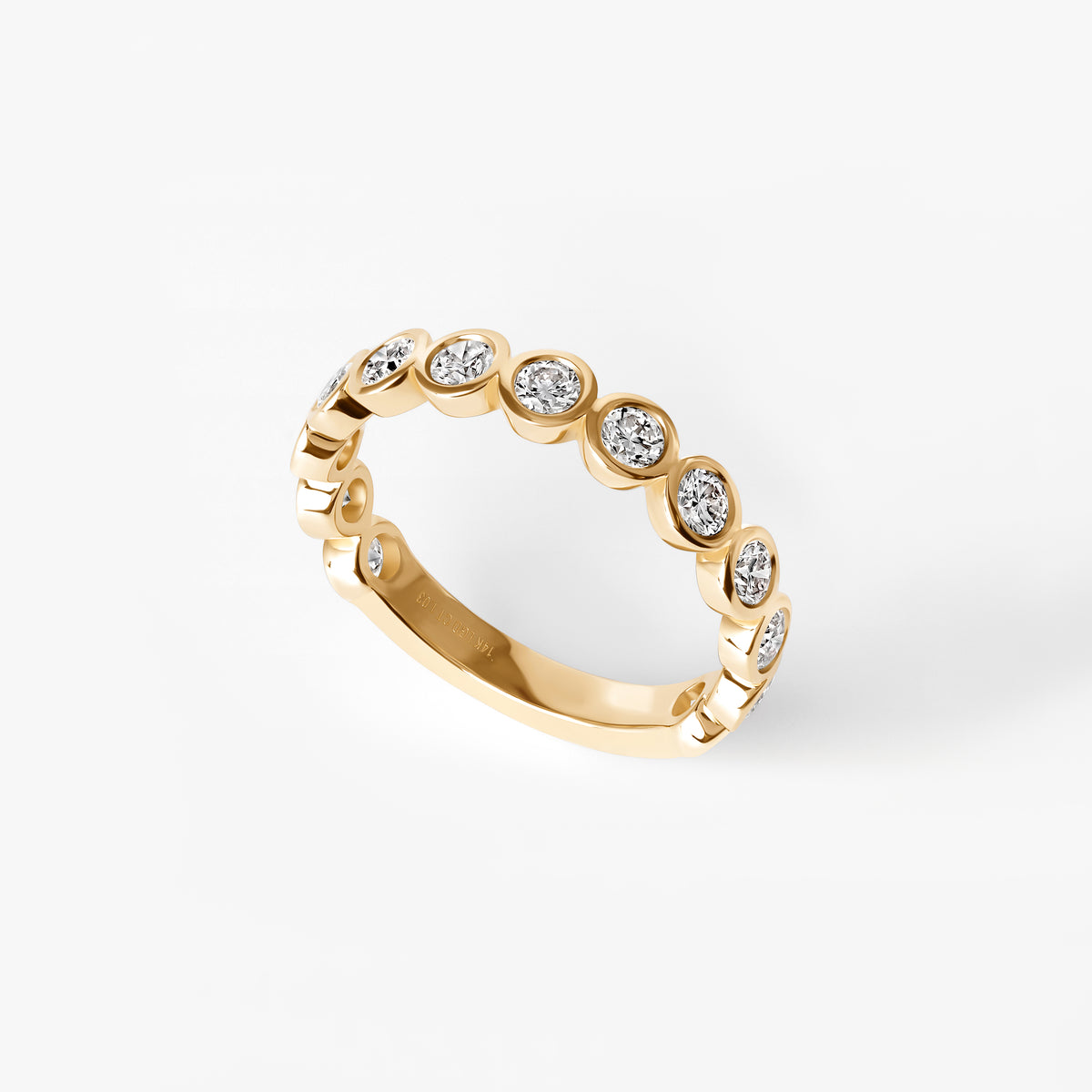 Round Diamond Bezel Set Three Quarter Eternity Band