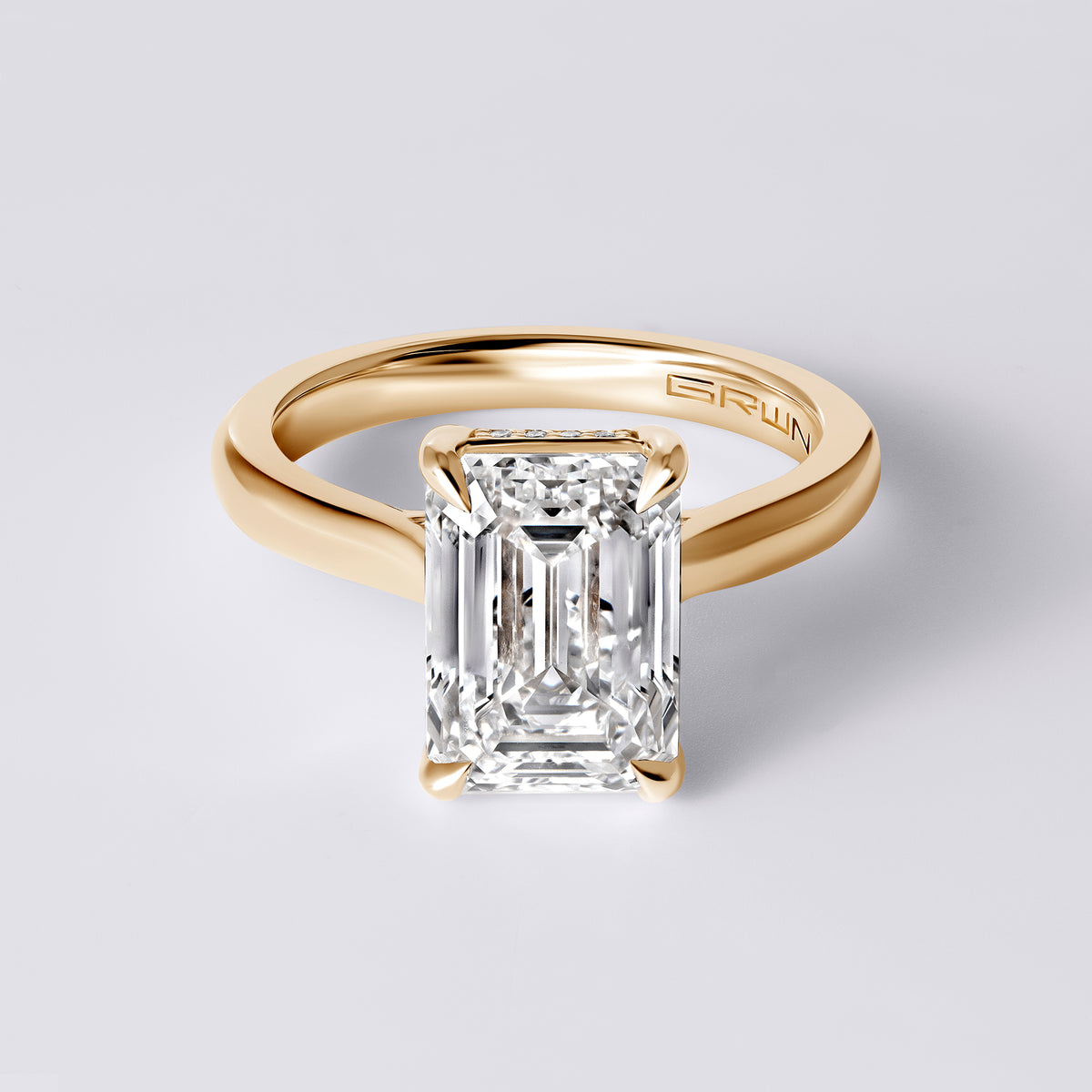 SORA 4.08CTW (4.02CT) EMERALD UNDERHALO CARESS ROUNDED SHANK, YELLOW GOLD