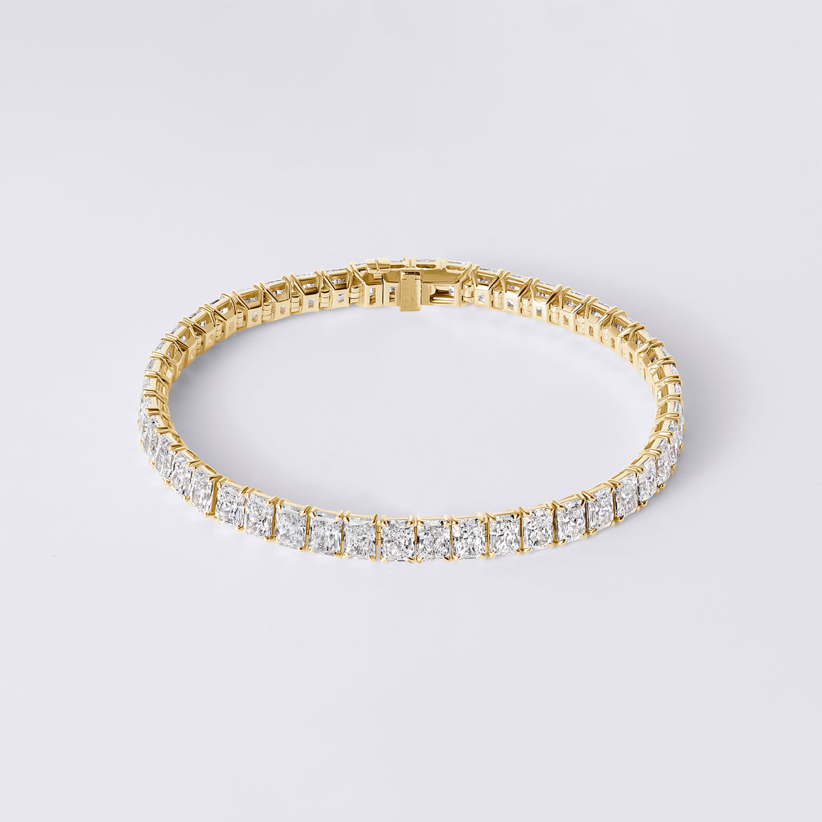 Radiant Cut 4 Prong Tennis Bracelet (16 7/8CTW), Yellow Gold