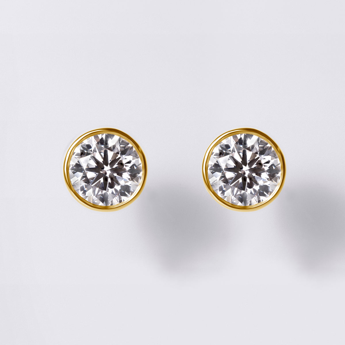 Round Brilliant Bezel Set Studs (2CTW), Yellow Gold