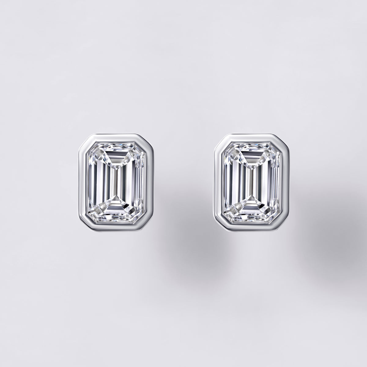 Bezel Set Emerald Lab Diamond Stud Earrings, White Rhodium