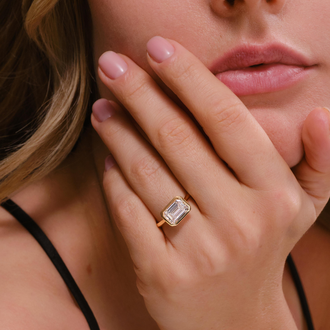 Lori 3.07CT Emerald East/West Bezel Set Engagement Ring, Yellow Gold